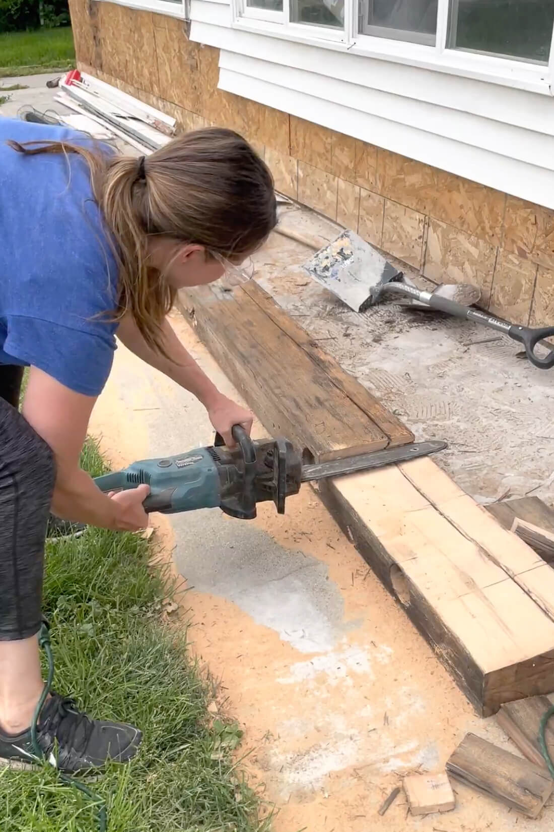 Using a chainsaw to cut down a mantle.